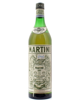 Gammel Martini Extra Dry flaske med falmet grønt glas og hvidt etikettedesign