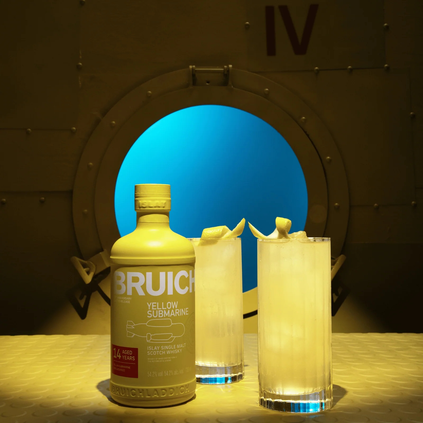 Bruichladdich Yellow Submarine Coastal Collins in two highball glasses with lemon twist